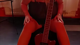 Amateur Milf Plays Guitar While Seductively Exposing Her Large Breasts